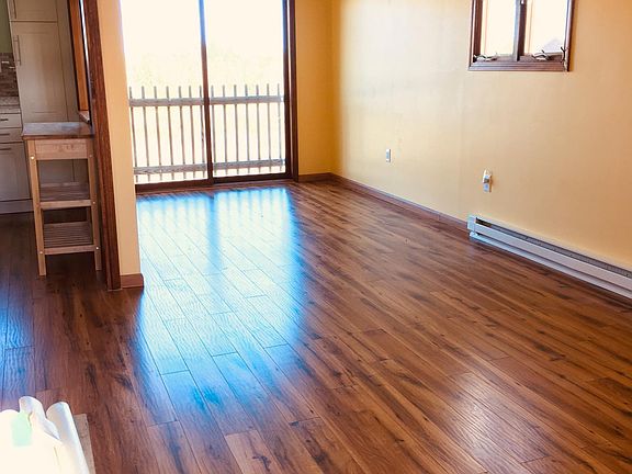 Open floor plan, living room to dining room with sliding door.