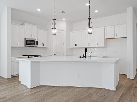 Kitchen. Sample product photo. Actual exterior and interior selections may vary by homesite. Photo m