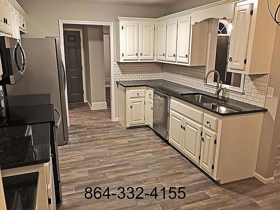 Kitchen opens up to the spacious living room area