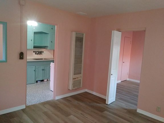 View from living room into kitchen and bedroom