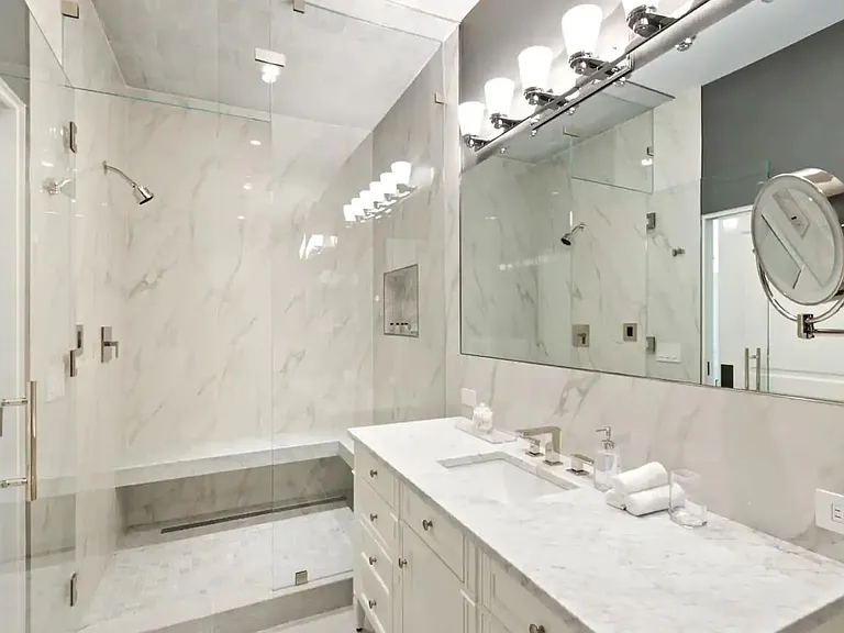 Marbling and glass make this bathroom an ultra luxury oasis.