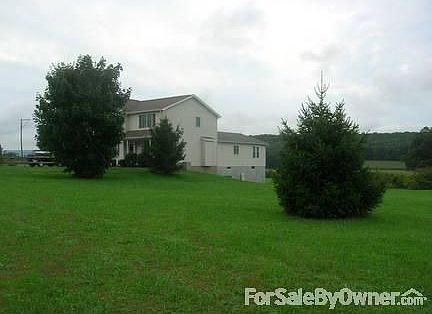 Side View
						:
						View from large yard with lots of space for an additional garage or pool.