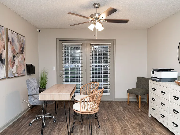 Spacious living room with hardwood-style flooring