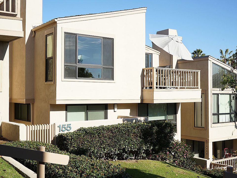 This two story sunny updated condo with balcony and patio