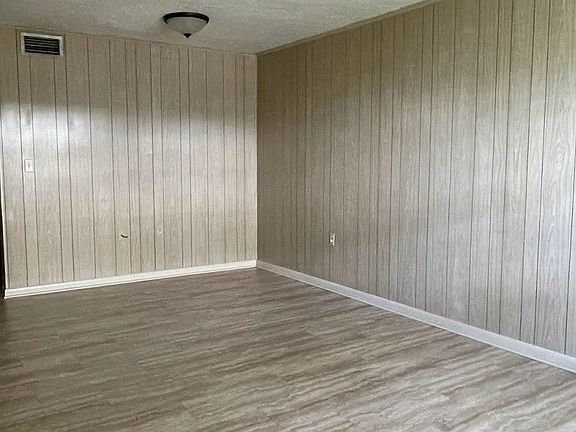 Living Room looking at the door to kitchen and dining area