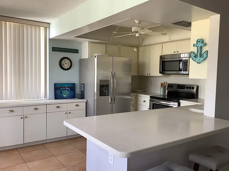 Kitchen with all brand new stainless steel appliance; open floor plan; counter top dining; plenty of cabinet space