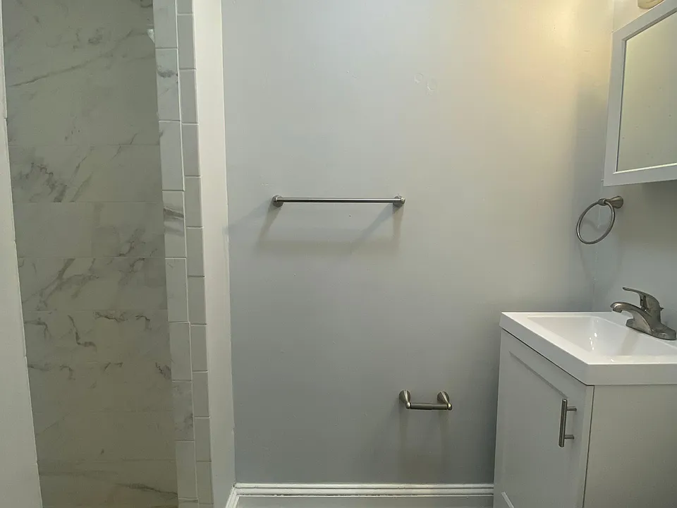 bathroom with brand new vanity, toilet, floor and tile
