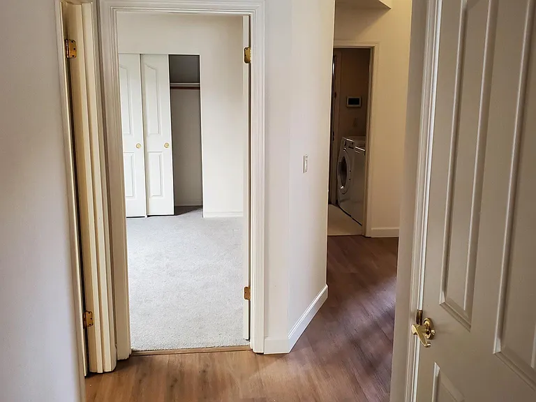 downstairs hallway from family room looking to downstairs bath and guest room.