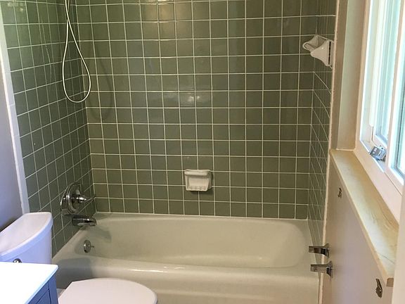 Master bath with new toilet, new floor tile and new vanity. 