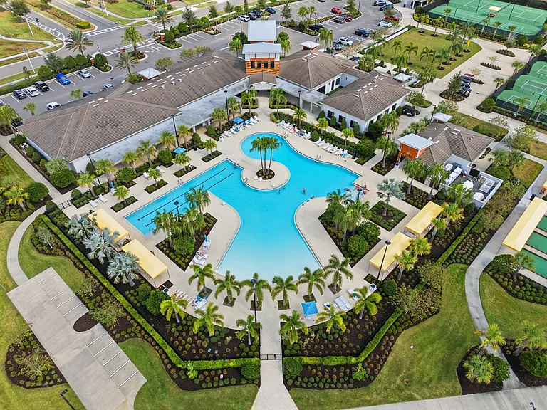 Medley at Mirada Exclusive Clubhouse with restaurant, pool, fitness center, tennis & pickle ball courts, and a community mailbox.