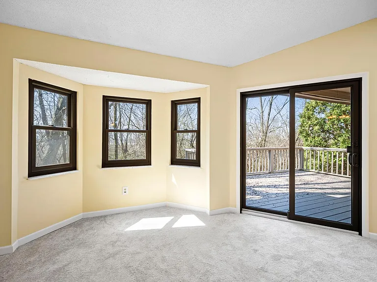 Upper level living area with walk out to deck