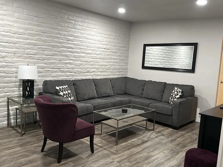 Spacious living room with large couch for the family