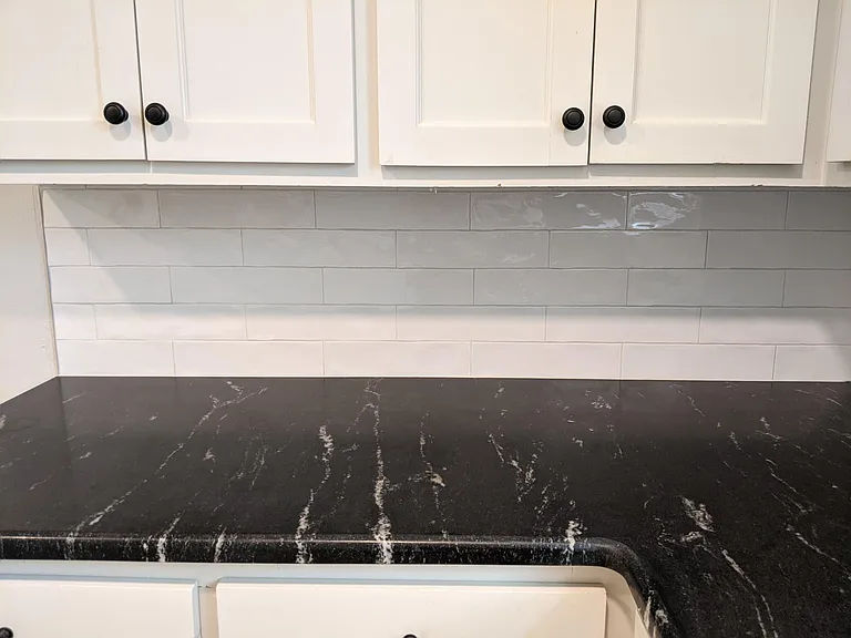 New granite and backsplash in kitchen
