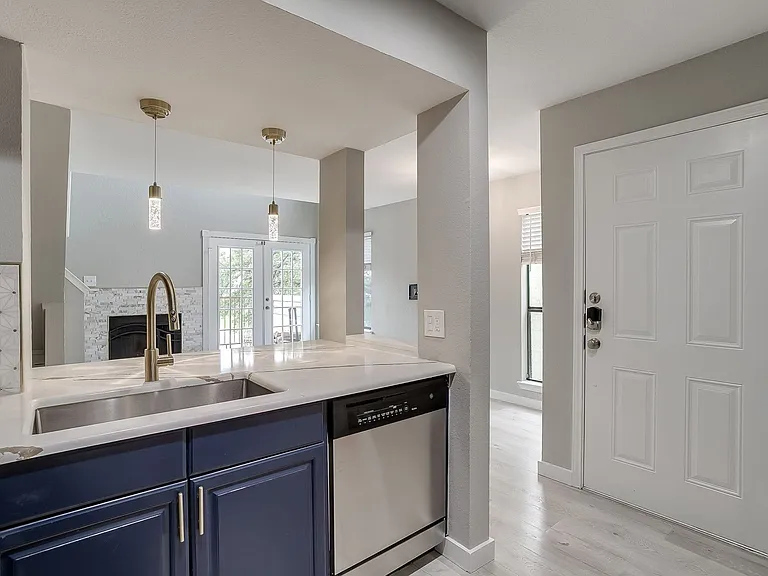 Kitchen opens to Living and Breakfast areas.