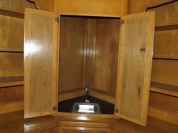 A WETBAR WITH PRIVACY SHUTTERS AFFORDS