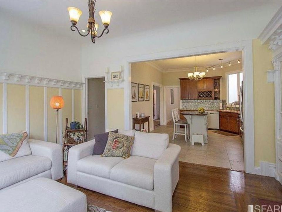Living room with staging furniture. Currently unfurnished