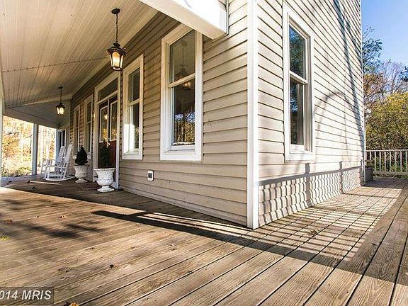 Covered Front Porch to Left, Open Deck area to right (leads to mud room door)