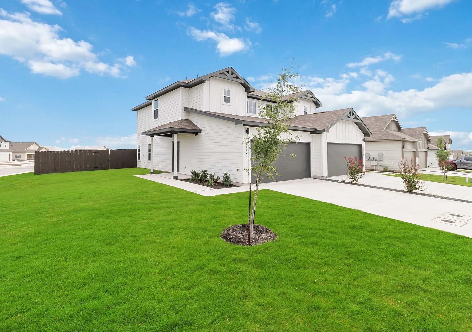 Brand-New 3-Bedroom Emma Park Townhome with Private Yard & 2-Car Garage — Photo 2
