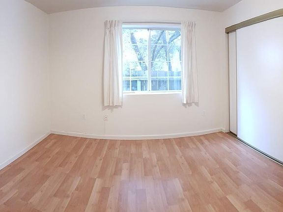 Front bedroom with storage space and closet