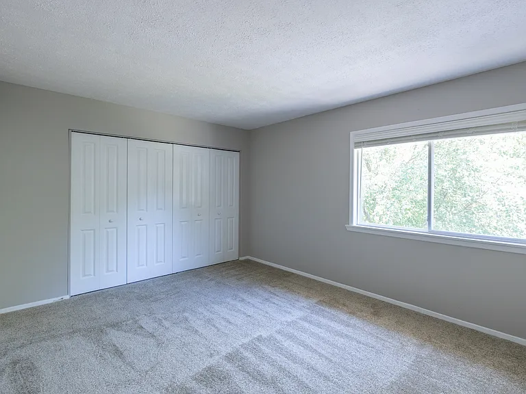 Primary Bedroom in the Two Bedroom Townhome at Woodbridge Bloomington