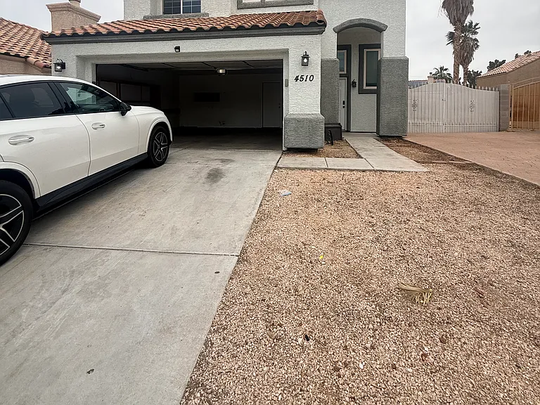 Garage and driveway parking with gated Rv parking.