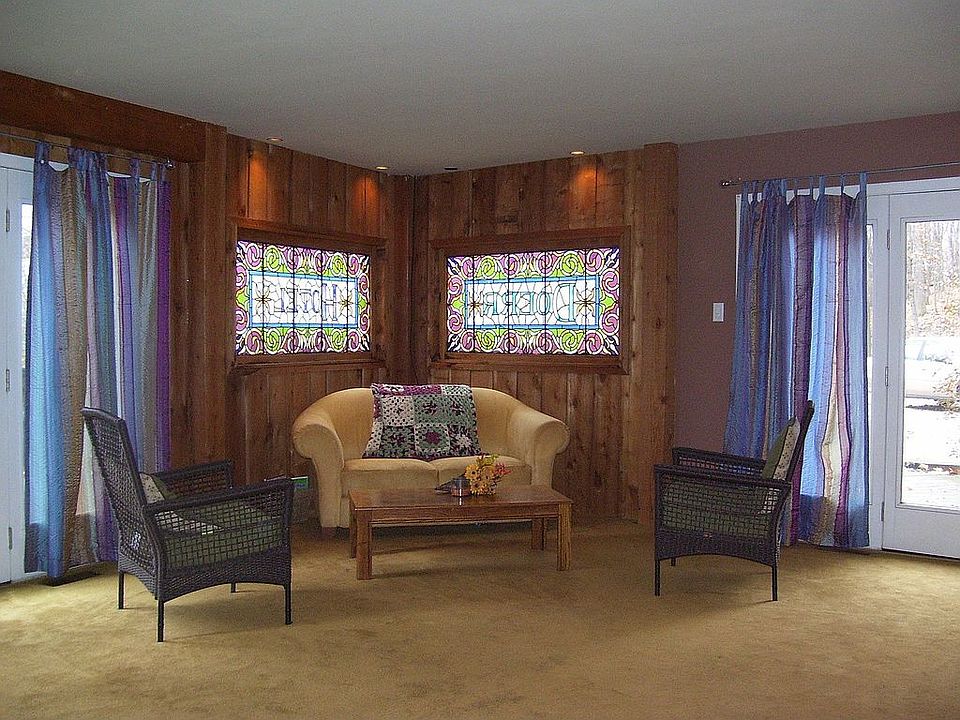 Living room w/ 2 antique stained glass windows