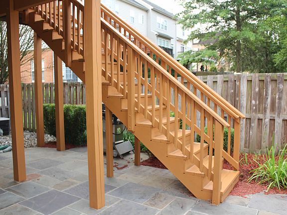 Fenced-in Backyard view with stone patio