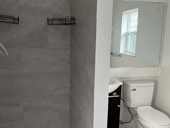 Recently-renovated bathroom, large format tile shower