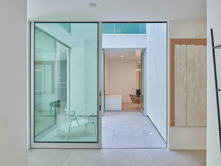 Private Courtyard Patio with Minimalist Elegance _ A striking architectural feature that brings in an abundance of natural light, enhancing the open and airy design of this residence.