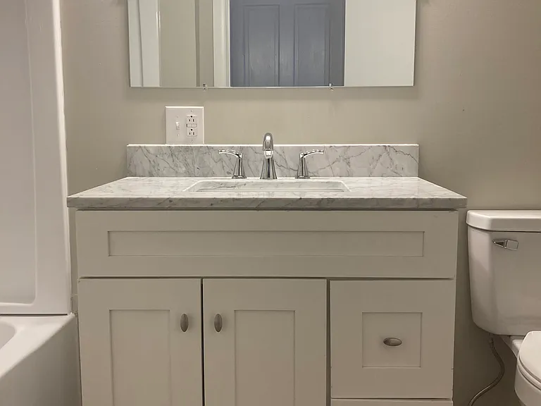 Brand new vanity with marble top.