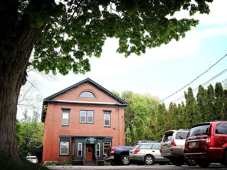 Front of building with parking in front