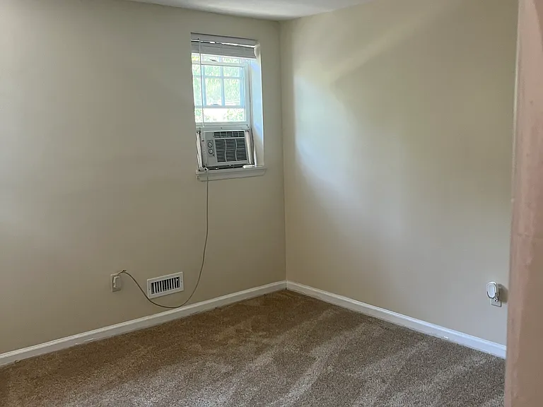 Bedroom 1 Master with a walk-in closet. Windows facing the street with lots of natural light.