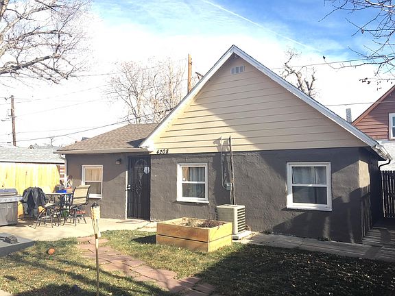 front entry, stone path, patio and 1 of 2 raised beds