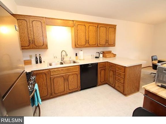 Vaulted and open to the dining room, includes the appliances.