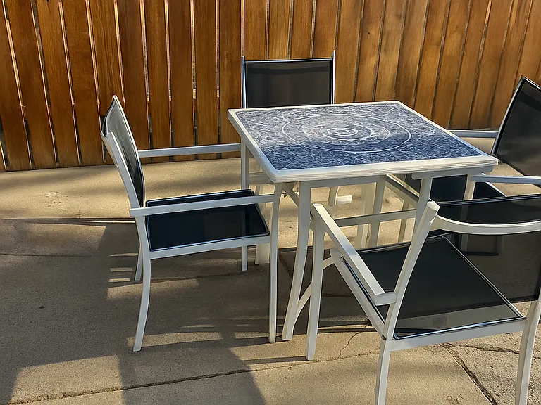 Whether it's breakfast in the sun or dinner under the stars, this cozy patio has you covered.