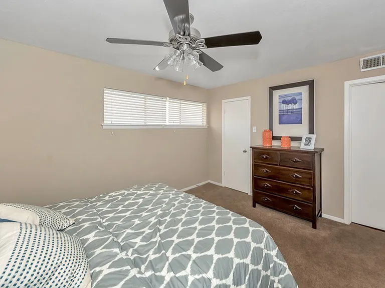 Comfortable bedroom layout with neutral finishes