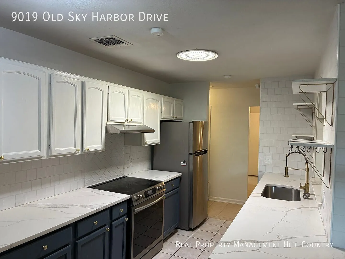 Renovated 5 Bed 2 Bath with Stone Fireplace + Quartz Kitchen — Photo 3