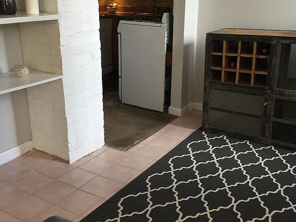 Living room with exposed brick shelves