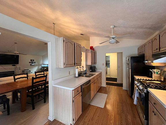 Kitchen includes oven, stove, fridge, dishwasher and garage disposal