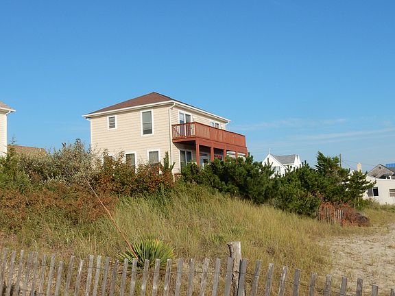 Tucked in beachfront dunes.