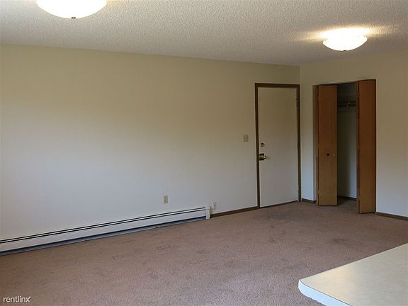 Living Room with coat Closet to Entry Door