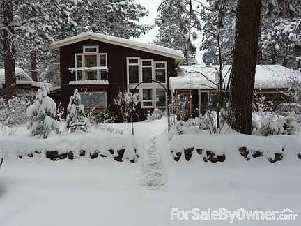 Front of house with rock wall