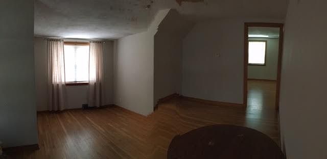 Living room. East facing (house front) double window and ceiling fan.