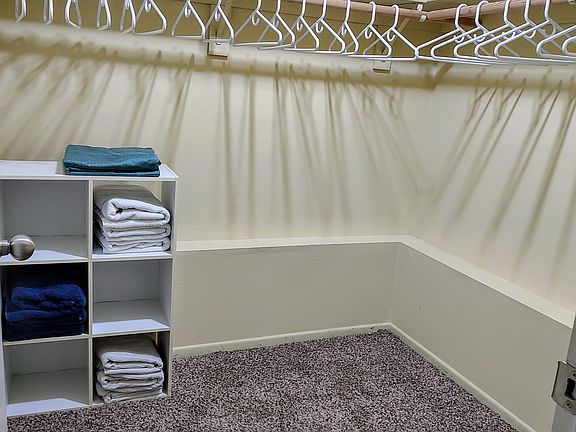 Walk-in closet within bedroom area