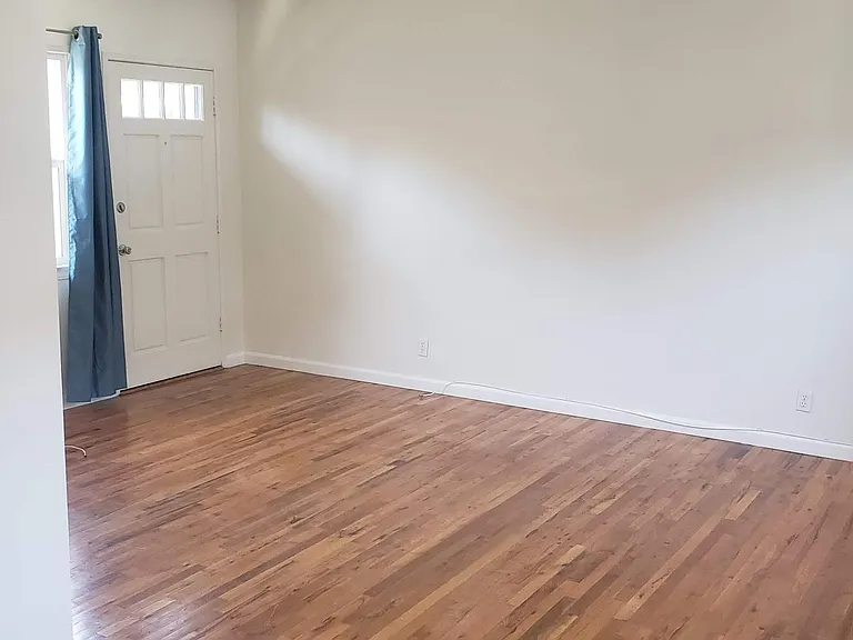 Living Room with beautiful hardwood floors and lots of light