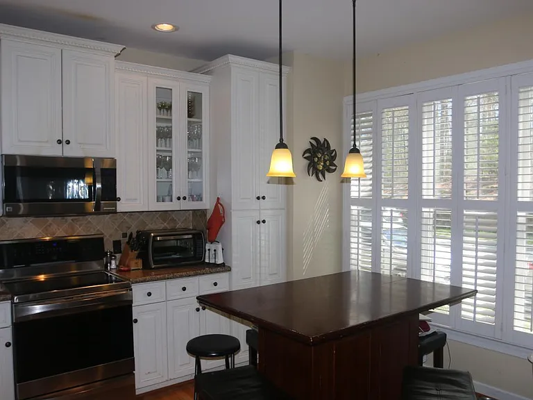 Kitchen with stainless steel appliances and induction stove