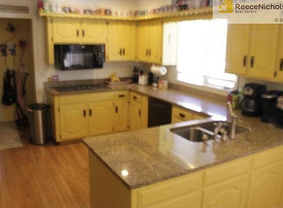 Wood floors, granite counters, big pantry, double ovens, great w