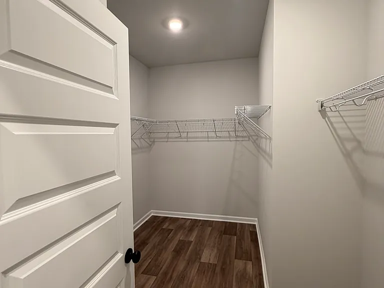 Walk-in closet in first floor primary suite