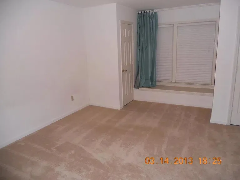 master bedroom with full bath and laundry