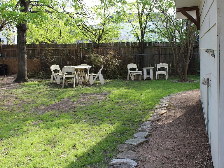 Back yard. Wood furniture stays.
